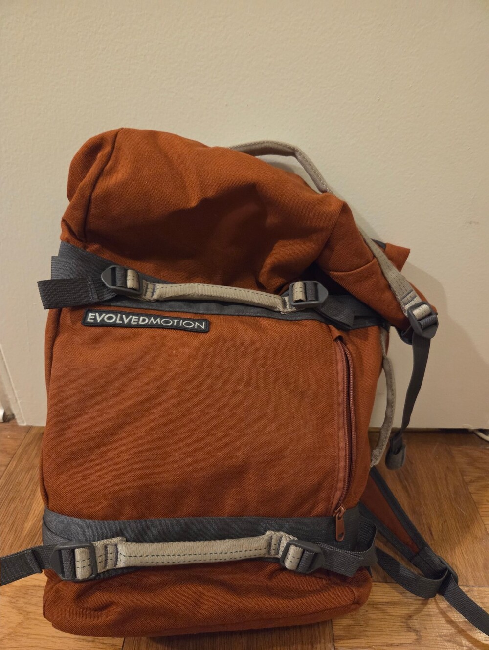 evolved motion roll top backpack, orange
